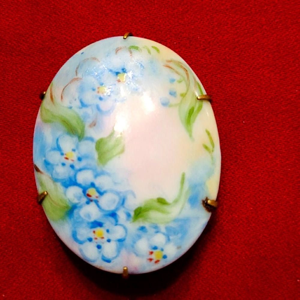 Antique painted ceramic flower brooch.
